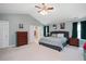 Spacious main bedroom with en-suite bathroom, ceiling fan and natural light at 118 Benedum Pl, Cary, NC 27518