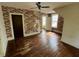 Bedroom with hardwood floors and vintage wallpaper at 121 W Young Ave, Henderson, NC 27536