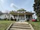 Charming two-story home featuring a covered front porch and traditional architecture at 121 W Young Ave, Henderson, NC 27536