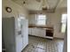 Functional kitchen with appliances and ample cabinet space, needs renovation at 121 W Young Ave, Henderson, NC 27536