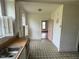 Bright kitchen featuring ample counter space, a sink and natural light, needs renovation at 121 W Young Ave, Henderson, NC 27536
