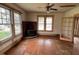 Spacious living room with hardwood floors and vintage-inspired design, great natural lighting at 121 W Young Ave, Henderson, NC 27536
