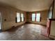 Bright living room featuring original hardwood floors, fireplace and natural light at 121 W Young Ave, Henderson, NC 27536