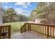 Spacious backyard with large deck, grassy lawn, trampoline, and storage shed at 125 Camden Dr, Youngsville, NC 27596
