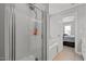 Elegant bathroom featuring walk in shower, soaking tub, and neutral color palette at 125 Camden Dr, Youngsville, NC 27596