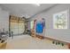 Two car garage featuring shelving and ample storage space at 125 Camden Dr, Youngsville, NC 27596