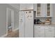Bright kitchen features white cabinets, granite countertops, and stainless steel appliances at 125 Camden Dr, Youngsville, NC 27596