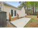 Home's backyard featuring a concrete patio and double doors at 1306 Ed Cook Rd, Durham, NC 27703
