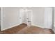 Bedroom features hardwood floors, a closet, and a door to an en-suite at 1306 Ed Cook Rd, Durham, NC 27703