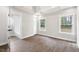 Bright bedroom with hardwood floors, a closet, and large windows at 1306 Ed Cook Rd, Durham, NC 27703