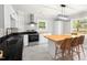 Bright kitchen features stainless steel appliances, black countertops, and a large island with seating at 1306 Ed Cook Rd, Durham, NC 27703