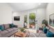 The living room is equipped with comfortable seating and provides access to the outdoor seating area at 1306 Ed Cook Rd, Durham, NC 27703