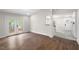 Spacious living room with a hardwood floor, lots of light, and views to the kitchen at 1306 Ed Cook Rd, Durham, NC 27703