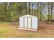 White metal storage shed in backyard, offering convenient outdoor storage at 1306 Ed Cook Rd, Durham, NC 27703