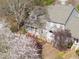 Aerial view of townhouses, landscaping, and brick walkway at 1426 Quarter Pt, Raleigh, NC 27615