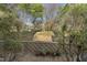 View of retaining wall with garden and trees at 1426 Quarter Pt, Raleigh, NC 27615