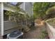 Exterior backyard of townhouse with retaining wall at 1426 Quarter Pt, Raleigh, NC 27615
