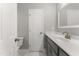 Updated bathroom featuring toilet, vanity, and bathroom doorway at 1426 Quarter Pt, Raleigh, NC 27615