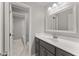 Bathroom featuring gray vanity, white countertops and tiles, and neutral colored floors at 1426 Quarter Pt, Raleigh, NC 27615