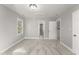 Neutral carpeted bedroom with en suite bathroom and bright gray walls at 1426 Quarter Pt, Raleigh, NC 27615