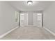 Empty bedroom with soft carpeting, dual closets, and natural light, perfect for creating a personalized space at 1426 Quarter Pt, Raleigh, NC 27615