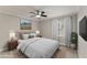 Cozy bedroom showcasing a plush bed, scenic artwork, and bright window at 1426 Quarter Pt, Raleigh, NC 27615