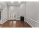 Living room featuring hardwood floors, skylights, and a fireplace at 1426 Quarter Pt, Raleigh, NC 27615