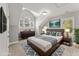 Stylish bedroom featuring a modern bed frame, sleek dresser, and serene window views at 1426 Quarter Pt, Raleigh, NC 27615