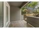 Wooden patio with gray siding and railing overlooking backyard at 1426 Quarter Pt, Raleigh, NC 27615