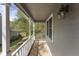 Charming covered front porch with gray siding and white trim at 1426 Quarter Pt, Raleigh, NC 27615
