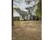 Large backyard with patio, privacy fence, mature trees, and plenty of space for outdoor activities at 144 Gremar Dr, Holly Springs, NC 27540