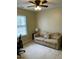 Bedroom furnished with a sofa, desk, chair, and a ceiling fan for comfort at 144 Gremar Dr, Holly Springs, NC 27540