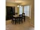 Comfortable dining area featuring natural light and a classic chandelier at 144 Gremar Dr, Holly Springs, NC 27540