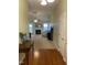 Inviting living room with a fireplace, ceiling fan, and views to a treed backyard at 144 Gremar Dr, Holly Springs, NC 27540