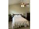 Serene main bedroom boasts a ceiling fan, neutral tones, and ample space at 144 Gremar Dr, Holly Springs, NC 27540