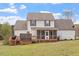 The backyard features a deck with built-in grill and space for entertaining at 15 Longwood Dr, Youngsville, NC 27596