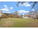 The expansive backyard features an outbuilding and deck at 15 Longwood Dr, Youngsville, NC 27596