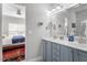 Bright bathroom showcasing a double vanity, a walk-in shower, and neutral color palette at 15 Longwood Dr, Youngsville, NC 27596