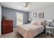 Comfortable bedroom with neutral paint, large window, and a cozy bed at 15 Longwood Dr, Youngsville, NC 27596