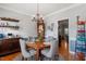 Elegant dining room featuring a round table, chandelier, and access to the kitchen at 15 Longwood Dr, Youngsville, NC 27596