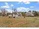 Charming two-story home with a well-manicured lawn and inviting front porch at 15 Longwood Dr, Youngsville, NC 27596