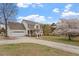 Charming two-story home with a well-manicured lawn, attached garage and inviting front porch at 15 Longwood Dr, Youngsville, NC 27596