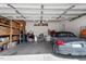 Well-organized garage with an Audi TT convertible, storage shelves, and plenty of room at 15 Longwood Dr, Youngsville, NC 27596