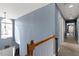 Bright hallway with natural light, neutral paint, and hardwood floors at 15 Longwood Dr, Youngsville, NC 27596