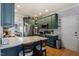 Charming kitchen with stainless steel appliances, ample cabinetry, and a large island at 15 Longwood Dr, Youngsville, NC 27596