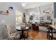Bright living room with hardwood floors, neutral paint, and cozy seating area at 15 Longwood Dr, Youngsville, NC 27596