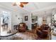 Cozy living room with hardwood floors, neutral paint, and an inviting seating area at 15 Longwood Dr, Youngsville, NC 27596
