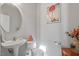 Chic powder room features a stylish vanity, a unique mirror, and elegant decor at 15 Longwood Dr, Youngsville, NC 27596