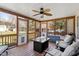 Inviting screened porch with outdoor seating, ceiling fan, and views of the backyard at 15 Longwood Dr, Youngsville, NC 27596