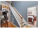 A blue wall highlights the staircase, leading to the second story at 15 Longwood Dr, Youngsville, NC 27596